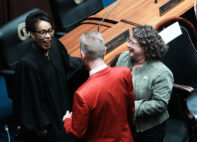 Kentucky Supreme Court Justice Pamela R. Goodwine, left, greeted attendees ahead of Governor Andy Beshear's State of the Commonwealth address at the Kentucky State Capitol on Jan. 8, 2025.