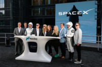 FILE PHOTO: President and COO of SpaceX Gwynne Shotwell, SpaceX CFO and President of Strategic Acquisitions Bret Johnsen, SpaceX Vice President for Human Resources Brian Bjelde, Nasdaq CEO Adena Friedman and others pose on a balcony at the Nasdaq MarketSite after the closing bell, on the day of SpaceX's initial public offering (IPO), in New York City, U.S., June 12, 2026. REUTERS/Brendan McDermid/File Photo