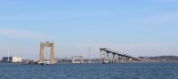 The remnants of the Francis Scott Key Bridge over the Patapsco River after a container ship collided with the span on March 26, 2024. (Mira Beinart/Capital News Service)